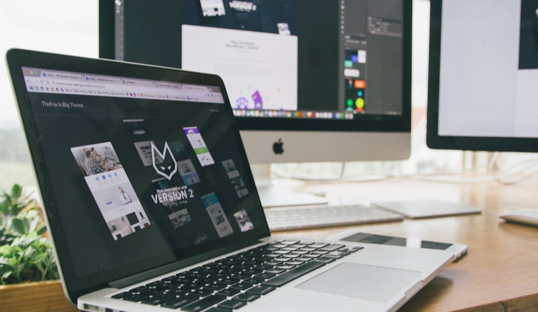 A stylish workspace featuring a laptop and monitors displaying design software.