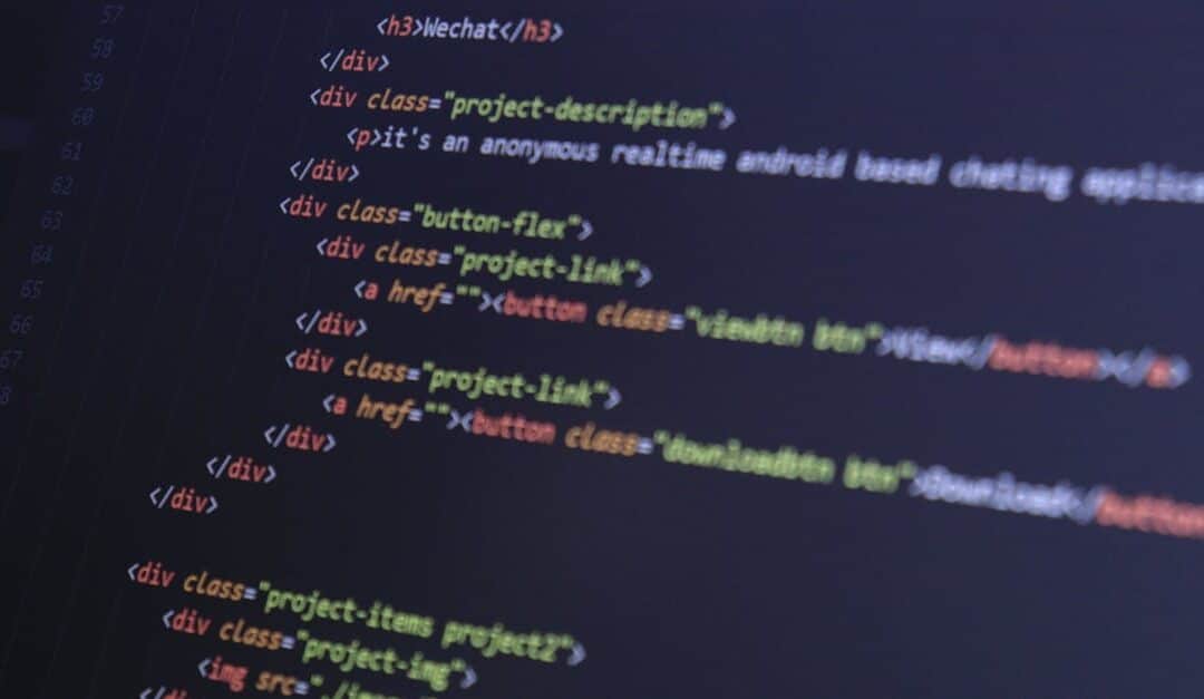 Close-up of HTML code with syntax highlighting on a computer monitor.