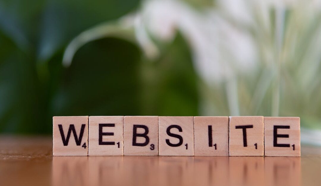 Scrabble tiles on a wooden surface forming the word 'Website', symbolizing digital communication.
