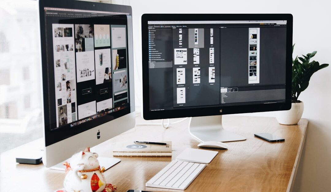 A well-organized design workspace with dual monitors and design software on display.