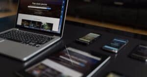 A contemporary workspace showcasing a laptop, tablet, and smartphones, ideal for tech and freelance use.