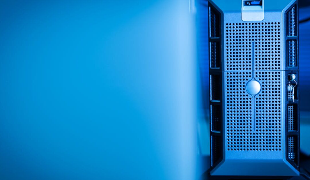 Close-up of a modern server unit in a blue-lit data center environment.