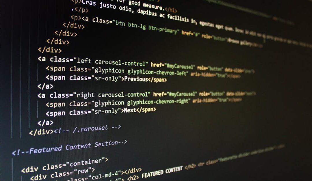 Close-up of HTML code displayed on a computer monitor, showcasing web development.