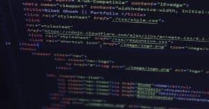 Close-up of HTML and CSS code displayed on a computer screen, ideal for tech and programming themes.